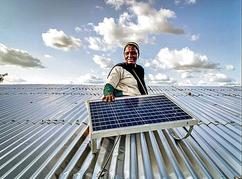 A woman with a solar panel