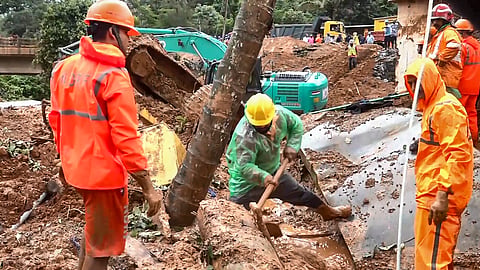 Rescue personnel carry out operations at the site of a massive landslide that struck the under-construction twin tunnel project at Kalladi near Meppadi, in Wayanad district, Kerala, Wednesday, July 8, 2026. 
