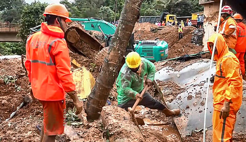 Rescue personnel carry out operations at the site of a massive landslide that struck the under-construction twin tunnel project at Kalladi near Meppadi, in Wayanad district, Kerala, Wednesday, July 8, 2026. At least three workers were killed and several others went missing in the incident. 