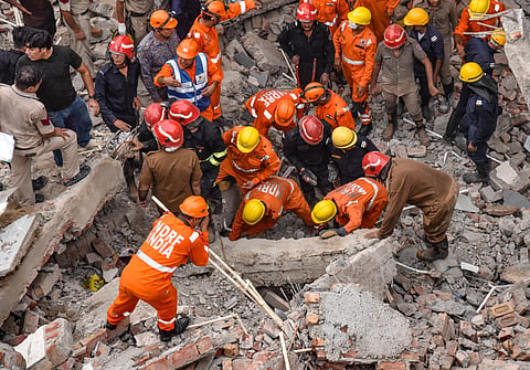 NDRF and other personnel conduct a rescue operation at the site after a three-storey under-construction house collapsed at Rohini amid heavy rainfall, in New Delhi, Wednesday, July 8, 2026. 