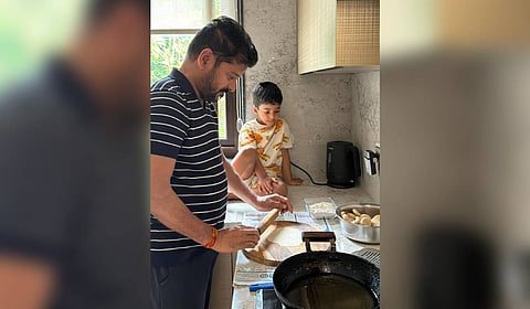 CM Revanth Reddy making puri for his Grand son at his residence in Hyderabad on Thursday.