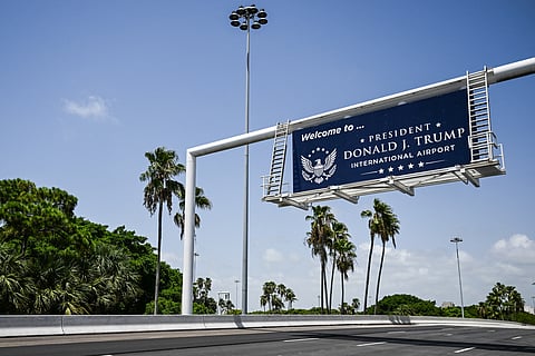 A new welcome sign reading "Donald J. Trump International Airport" is seen at the airport's main entrance ramp in West Palm Beach, Florida, on July 9, 2026.