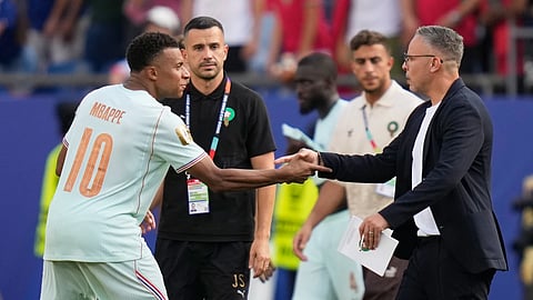 France's Kylian Mbappe (10) greets Morocco head coach Mohamed Quahbi after France won the World Cup quarterfinal soccer match between France and Morocco in Foxborough, Mass., near Boston, Thursday, July 9, 2026.