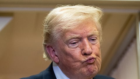 President Donald Trump listens to a question as he speaks with reporters in flight on Air Force One after landing at U.S. Air Force Base at RAF Mildenhall, in Suffolk, Eastern England, Wednesday, July 8, 2026.