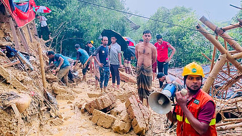 Rescuers work at the site of a landslide at a Rohingya refugee camp in Cox's Bazar, Bangladesh, Wednesday, July 8, 2026. 