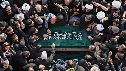 In this photo released by Iran's Supreme Leader's office, mourners carry the coffins of the late Iranian Supreme Leader Ayatollah Ali Khamenei and members of his family during funeral prayers held as part of the dayslong funeral ceremonies at the Holy Jamkaran Mosque in Qom, Iran, Tuesday, July 7, 2026. 