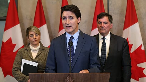 Canadian Prime Minister Justin Trudeau—with foreign minister Mélanie Joly and public safety minister Dominic LeBlanc—during a press conference on Parliament Hill in Ottawa on October 14, 2024