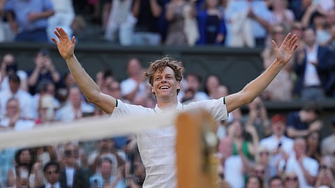 Jannik Sinner of Italy celebrates after defeating Alexander Zverev of Germany to win the men's singles final at the Wimbledon Tennis Championships in London, Sunday, July 12, 2026. 