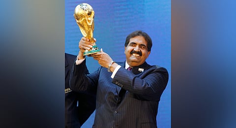 Sheikh Hamad bin Khalifa Al Thani, Emir of Qatar, holds the World Cup trophy after the announcement of Qatar hosting the 2022 soccer World Cup in Zurich, Switzerland, Dec. 2, 2010.