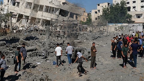 Palestinians gathered around the site of an Israeli military drone strike on a blacksmith shop in Gaza City's Sabra neighbourhood, killing at least four Palestinians and wounding another, according to officials at Shifa Hospital, where the casualties were taken on Sunday, July 12, 2026.