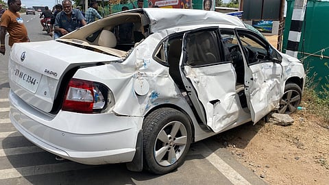 The damaged car involved in the accident after it was hit by a private bus in Sangagiri..