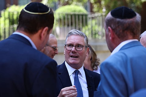 Britain's Prime Minister Keir Starmer, center, hosts a reception with the Jewish community, to discuss efforts to tackle antisemitism, at Downing Street in London, England, Monday, July 13, 2026. 