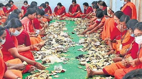Amid tight security, women workers count the money donated by devotees in hundis