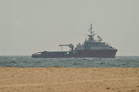 A ship sails off the coast of Ajman on July 10, 2026