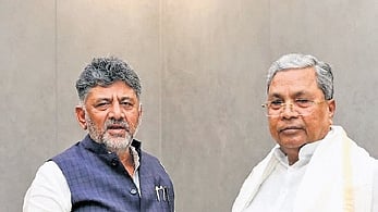 Chief Minister DK Shivakumar greets his predecessor Siddaramaiah in Bengaluru on Wednesday 