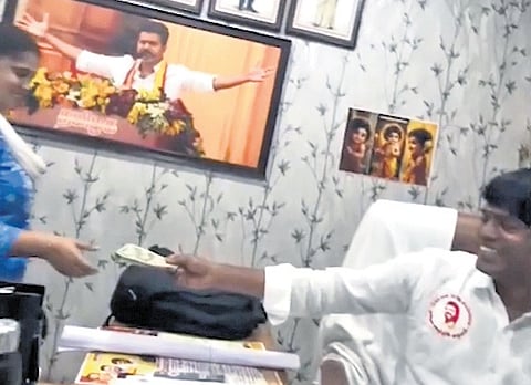 Screenshot of a clip allegedly showing Mambakkam panchayat president Veerasami accepting bribe.