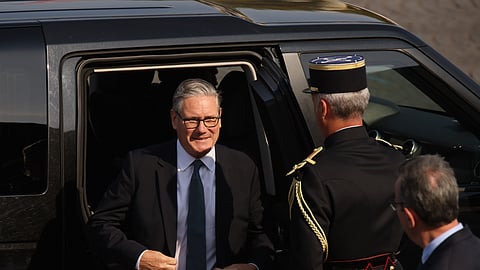 British Prime Minister Keir Starmer arrives for the Bastille Day military parade on the Champs-Elysees avenue in Paris, Tuesday, July 14, 2026.