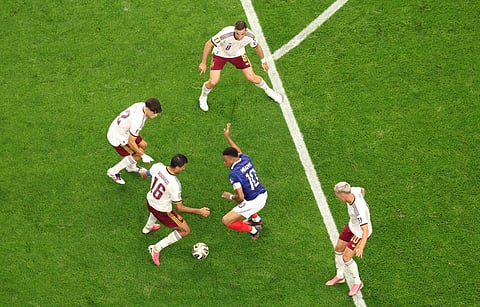 France's Kylian Mbappe being surrounded by Spanish players during the semifinal clash at Dallas Stadium on Tuesday