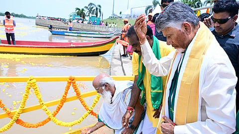 CM Nara Chandrababu Naidu performs Jala Harati at Pavitra Sangamam near Ibrahimpatnam where Krishna and Godavari waters merge on Wednesday.