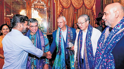 Chief Minister A Revanth Reddy greets BRICS delegates during a dinner hosted at Falaknuma Palace in Hyderabad on Wednesday.