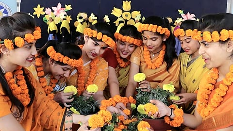 Families harvested green shoots sown in baskets nine days earlier and placed them on relatives’ heads while offering blessings during the Harela festival.