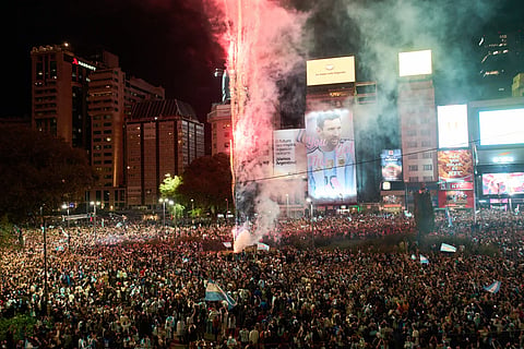 Fans celebrate Argentina’s victory over England in a World Cup semifinal soccer match in downtown Buenos Aires, Argentina, Wednesday, July 15, 2026. 