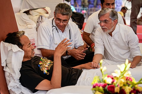 Congress leader Pawan Khera meets activist Sonam Wangchuk, who has been on a hunger strike for 20 days, during a protest by Cockroach Janata Party (CJP) against alleged irregularities in NEET and other examinations, at Jantar Mantar, in New Delhi, Thursday, July 17, 2026.