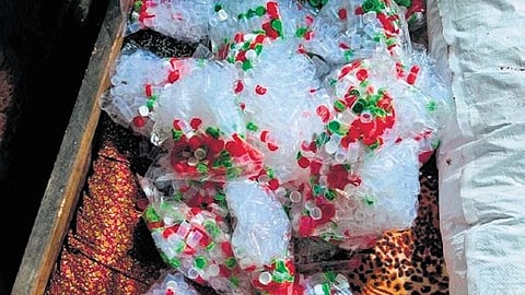 Hundreds of small bottles allegedly used for repackaging and supplying heroin, seized by the police