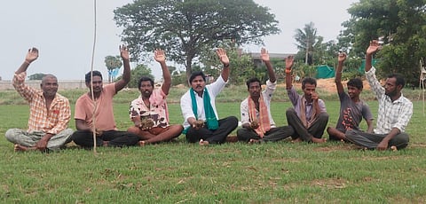 Farmers stage a protest amid a dried-up paddy nursery at Satyanarayanapuram in Denduluru mandal on Thursday, demanding the release of Pattiseema water to save crops.
