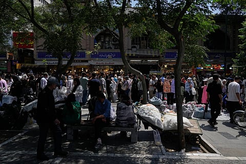 People walk around Tehran’s traditional main bazaar, Iran, Thursday, July 16, 2026.