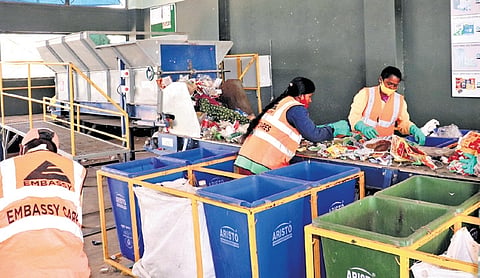 Collected garbage being processed at an integrated waste management facility in Bettahalasuru.