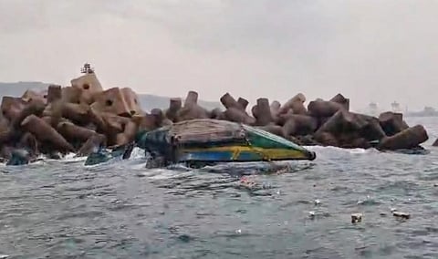 Seven fishermen had a narrow escape after their fishing boat capsized in rough seas near the Visakhapatnam Fishing Harbour on Thursday.