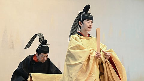 FILE - Japan's Prince Hisahito, right, attends his coming-of-age rituals on his 19th birthday at the Imperial Palace in Tokyo, on Sept. 6, 2025