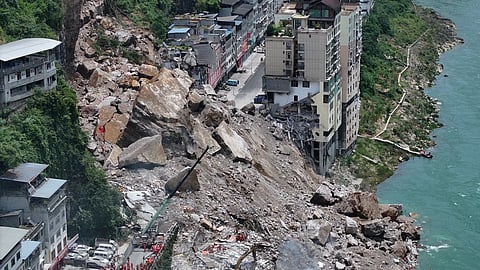 In this photo realeased by Xinhua News Agency, rescuers conduct search and rescue operation on the site of the landslide in Pengshui County in southwestern China's Chongqing on Friday, July 17, 2026.