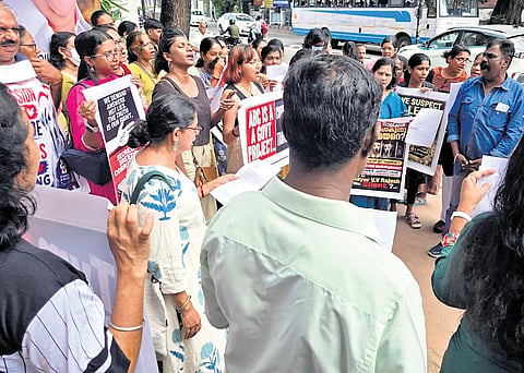 Members of People For Animals, animal lovers and feeders staging  protest in front of the corporation office on Friday, demanding that the civic body disclose the locations of shelters where captured stray dogs are being housed 