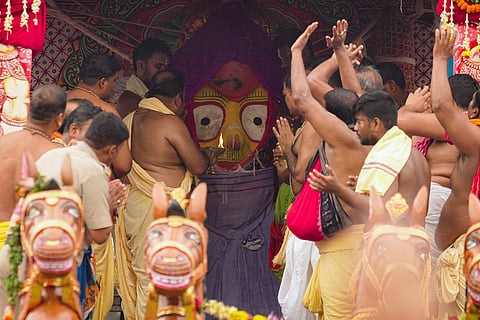 In this image posted on July 17, 2026, priests perform rituals as they offer prayers to Goddess Subhadra during the annual Rath Yatra festival, in Puri, Odisha. 