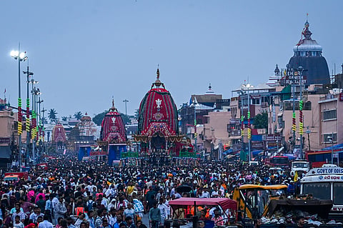 Lord Trinity atop their chariots begin their journey on the second day to Sri Gundicha Temple in Bada Danda as lakhs of devotees throng Puri to witness the annual Ratha Yatra on Friday. 