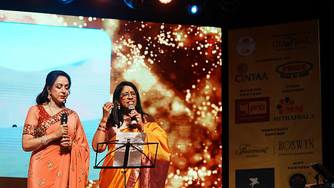 Kavita Krishnamurti sings with actor Hema Malini at a celebration for the latter’s diamond jubilee in cinema