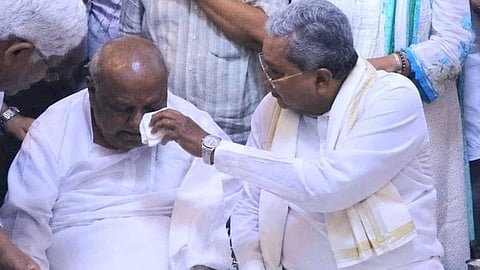 A grieving HD Deve Gowda being consoled by ex-CM Siddaramaiah, in Bengaluru on Saturday night.