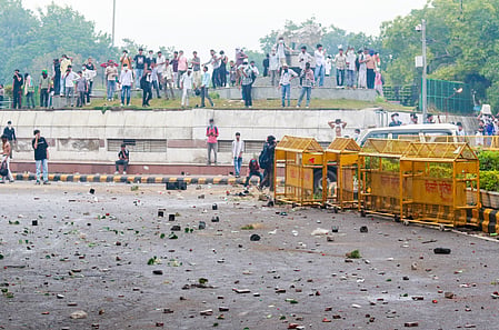 New Delhi: Supporters of the Cockroach Janta Party (CJP) stand amid tear gas as police personnel attempt to disperse them during the party’s ‘Chalo Sansad’ march towards Parliament near Jantar Mantar in New Delhi on Monday, July 20, 2026. 