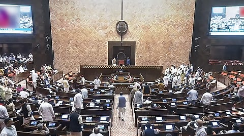 Proceedings of the Rajya Sabha get adjourned following the protest by opposition MPs during the Monsoon Session of the Parliament, in New Delhi on Tuesday.