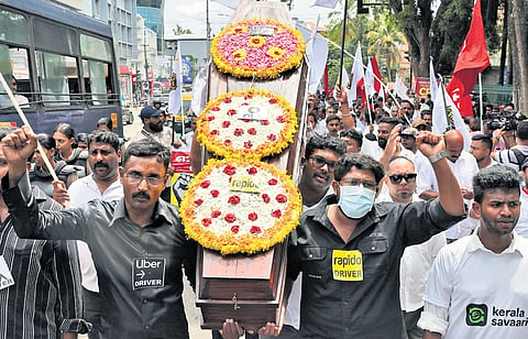 Online taxi drivers under the banner of the All Kerala Online Taxi Community take out a protest march to the Secretariat in Thiruvananthapuram on Tuesday demanding an end to unfair commission rates and measures to protect drivers’ jobs and income 