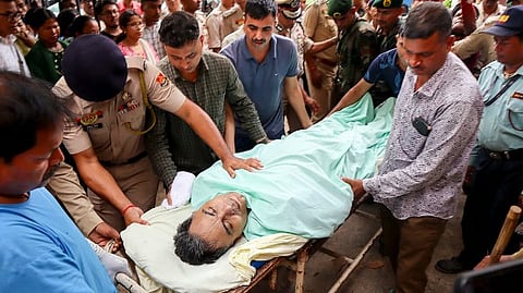 Officials carry the mortal remains of Tripura Director General of Police (DGP) Anurag Dhankar after he was found dead at his office, in Agartala, Monday, July 20, 2026.