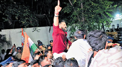 Karnataka Pradesh Youth Congress Committee members protest outside Lok Bhavan in Bengaluru on Tuesday.