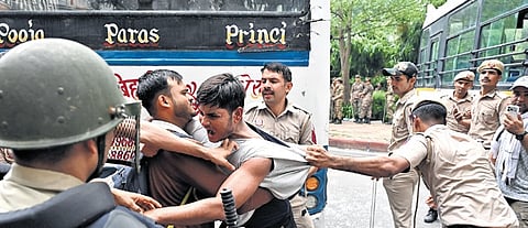 Delhi Police using force against protesters on Monday, July 20, 2026.
