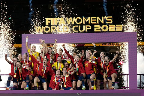 Team Spain celebrates with the trophy after winning the Women's World Cup soccer final against England at Stadium Australia in Sydney, Australia, August 20, 2023.