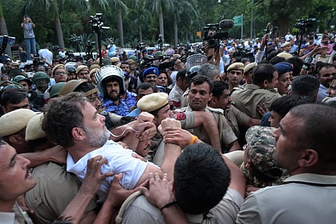 Police personnel detain Leader of Opposition in the Lok Sabha Rahul Gandhi during a sit-in protest near the Prime Ministers residence over alleged irregularities in the NEET examination, in New Delhi, Tuesday, July 21, 2026.