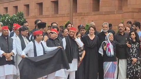 Opposition MPs wear black to parliament, stage protest against 'police brutality' on student protestors.