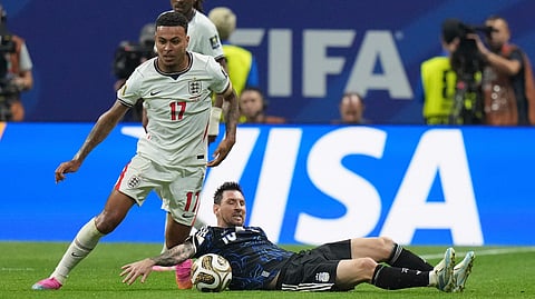 England's Morgan Rogers (17) and Argentina's Lionel Messi (10) fight for the ball during the World Cup semifinal soccer match between England and Argentina in Atlanta, Wednesday, July 15, 2026. 