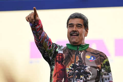 Venezuelan President Nicolas Maduro points to supporters during a campaign rally in the Catia neighborhood of Caracas, Venezuela, July 18, 2024.